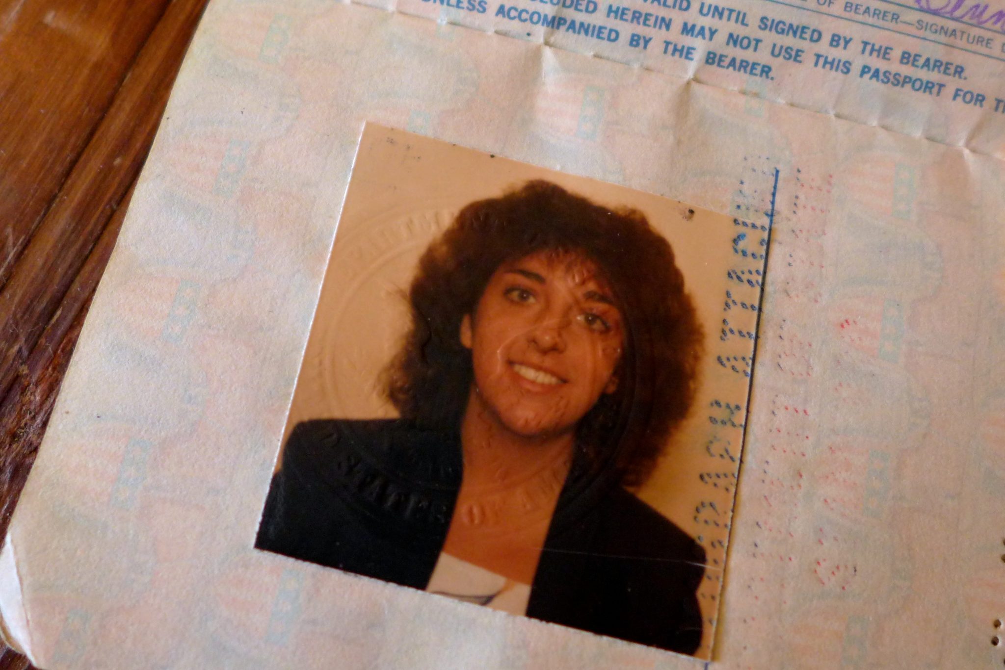 My first passport photo - starry-eyed, tan, and young.