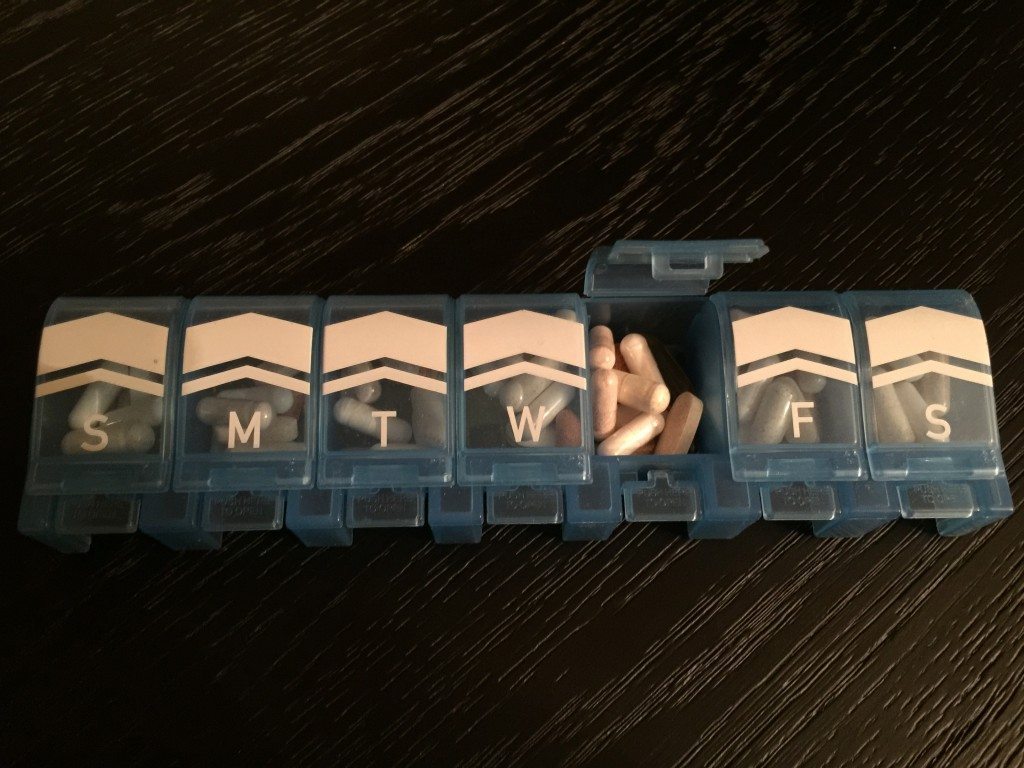 pill compartments labeled with days of the week