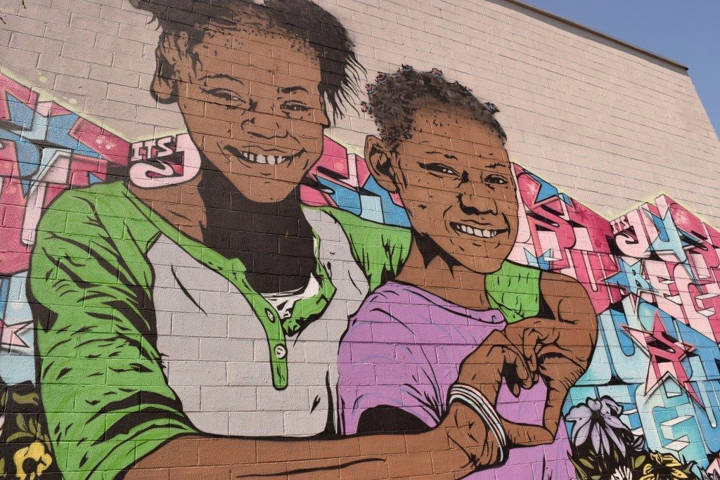 mural of two sisters in the Bushwick Collective