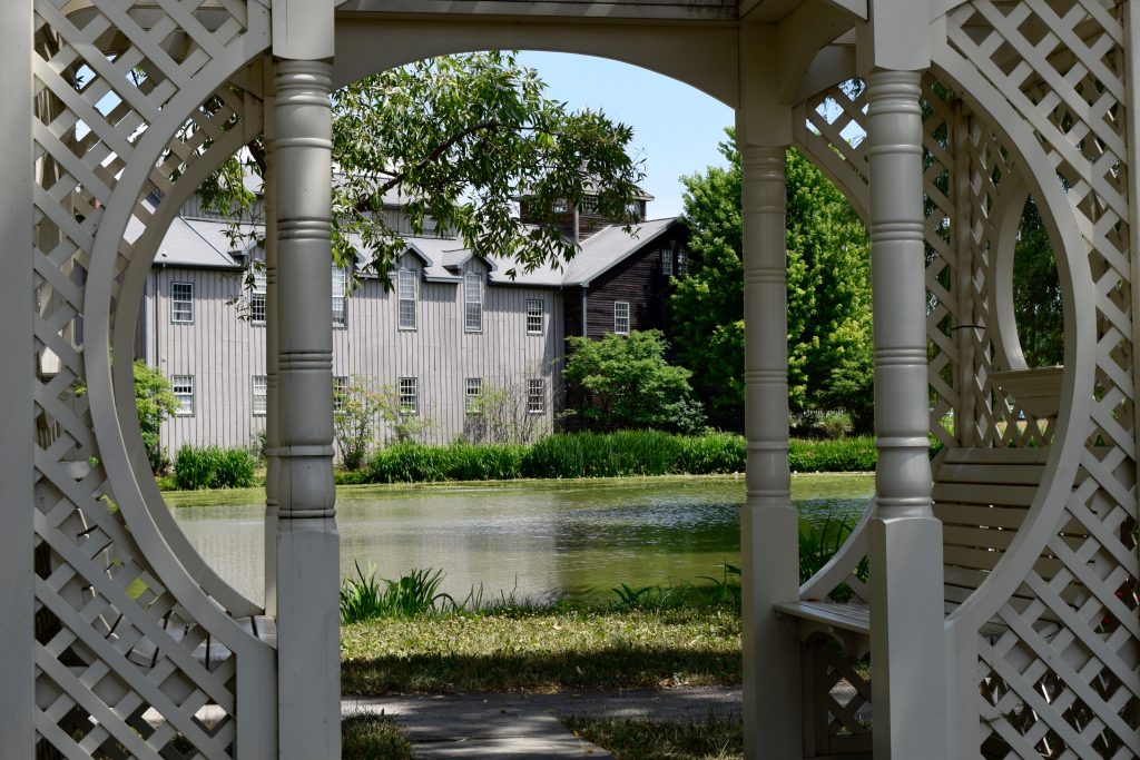 View through a gazebo at the Mackenzie-Childs farmhouse.