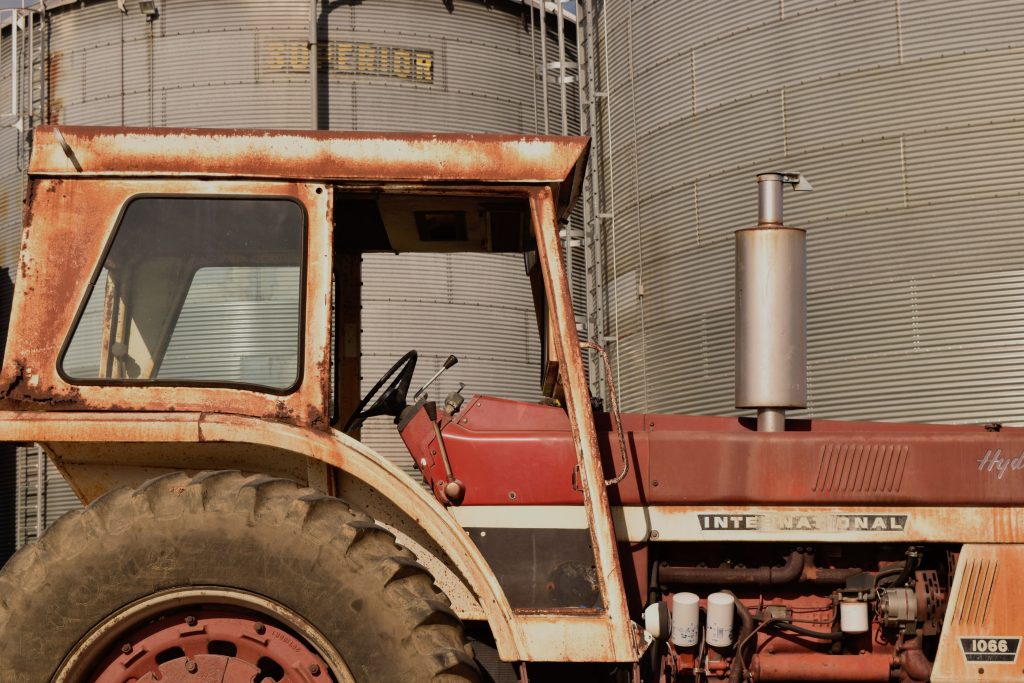 Photo tips for beginners include choosing the right subject, like this red, rusty tractor.