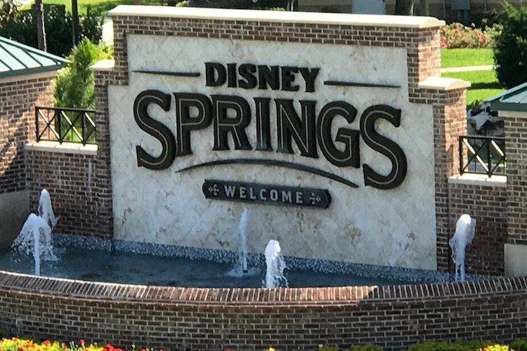 You'll wonder what to see at Disney Springs when you pass the sign. And Disney Springs is free.