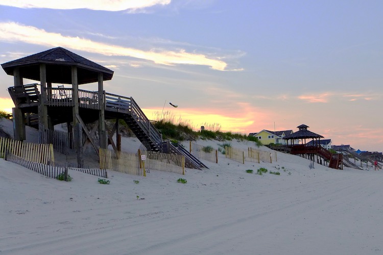 one of the best east coast beaches in the u.s. is the outer banks in north carolina here at sunset