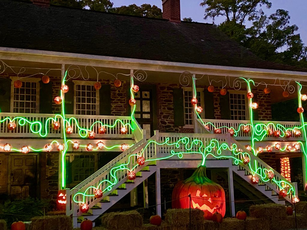 The Van Cortlandt Manor House with pumpkin vines at the Great Jack O'Lantern Blaze in Croton, New York, an annual Halloween festival near NYC.