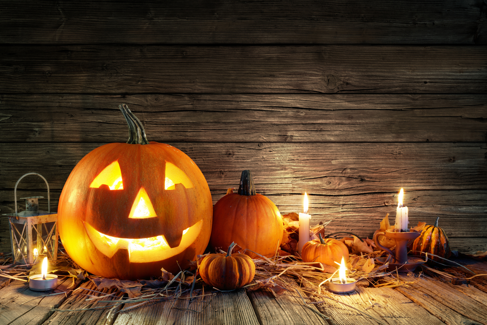 Pumpkins with dripping Halloween candles