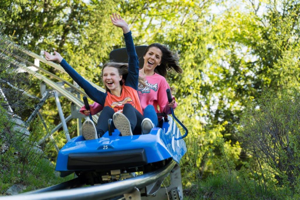 Family enjoying the Alpine coaster at Camelback Resort in spring