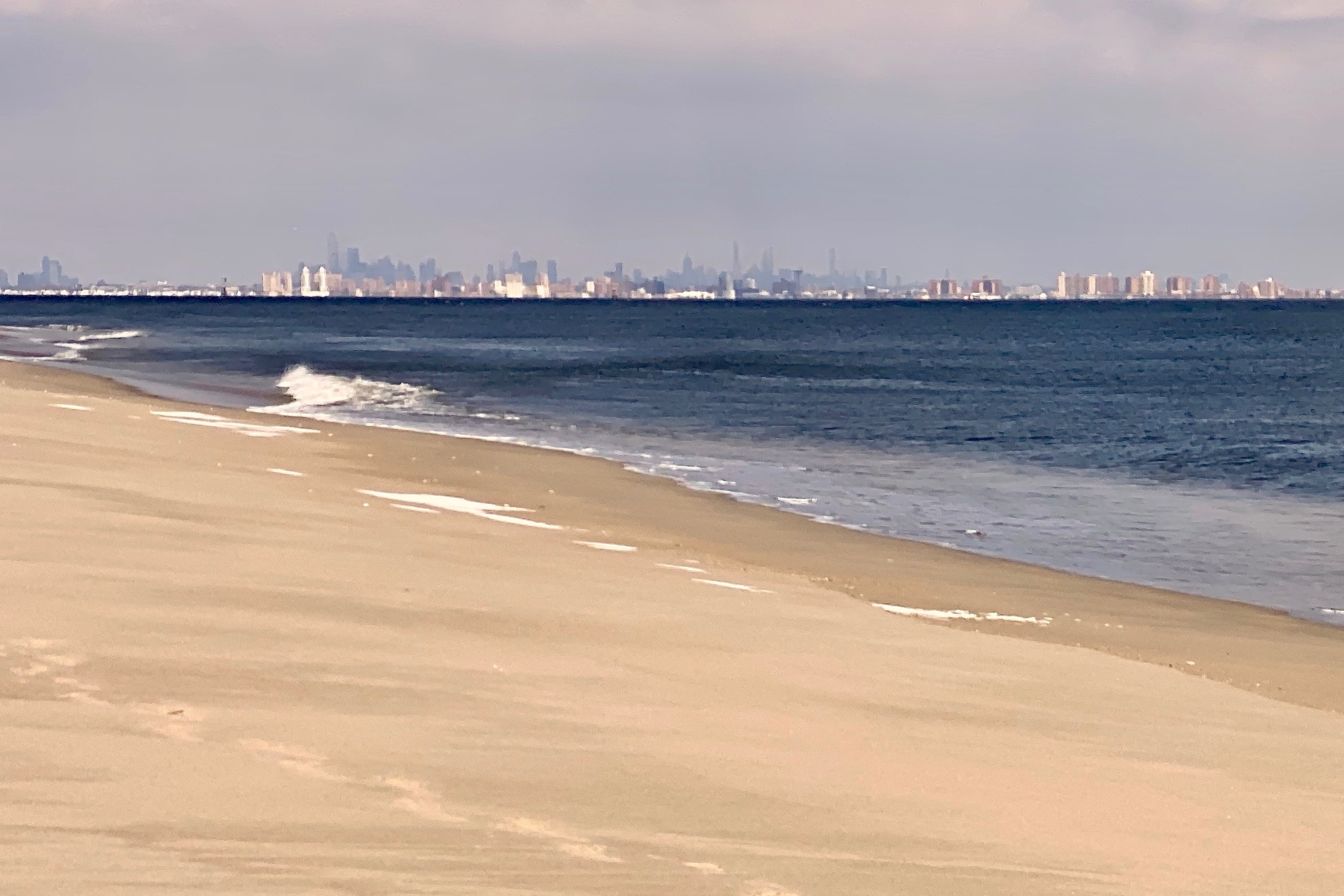 Empty beach and NYC skyline at Sandy Hook, a super east coast beach town