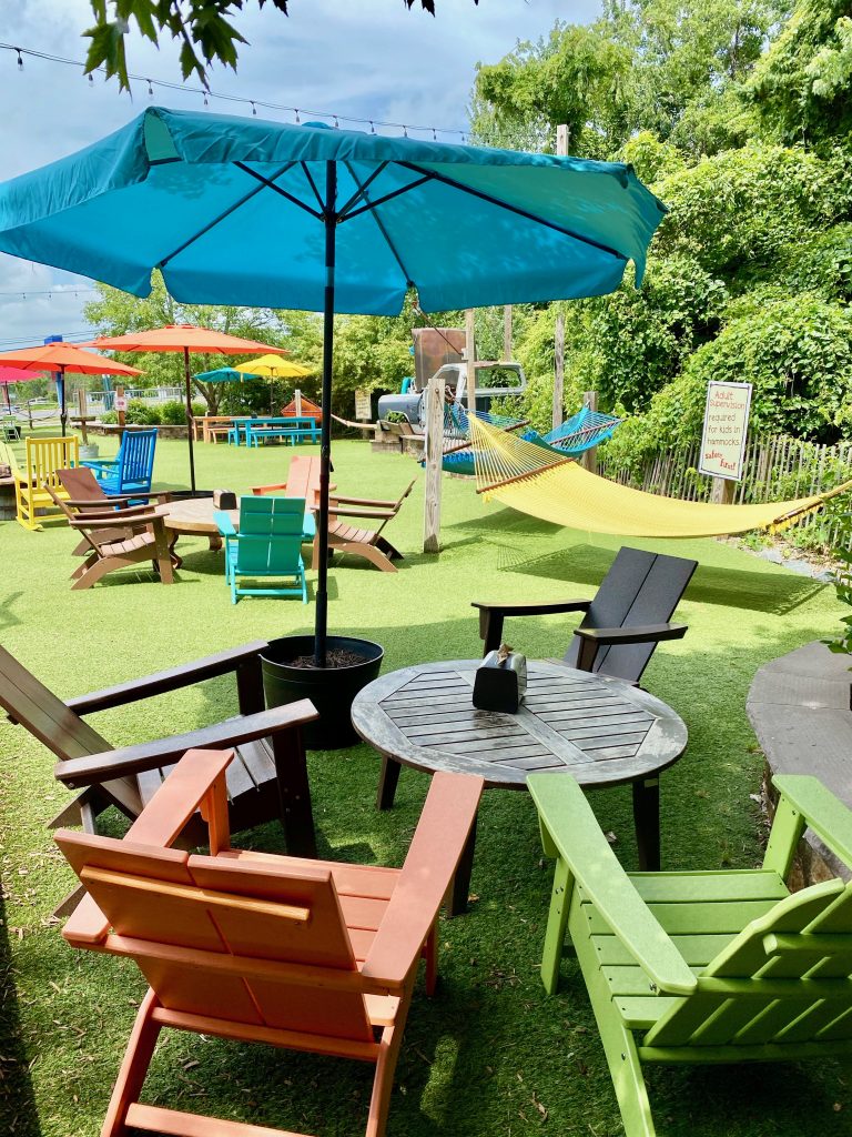 Colorful hammocks in the backyard of  Crooked Hammock brewery, one of the fun things to do in Delaware