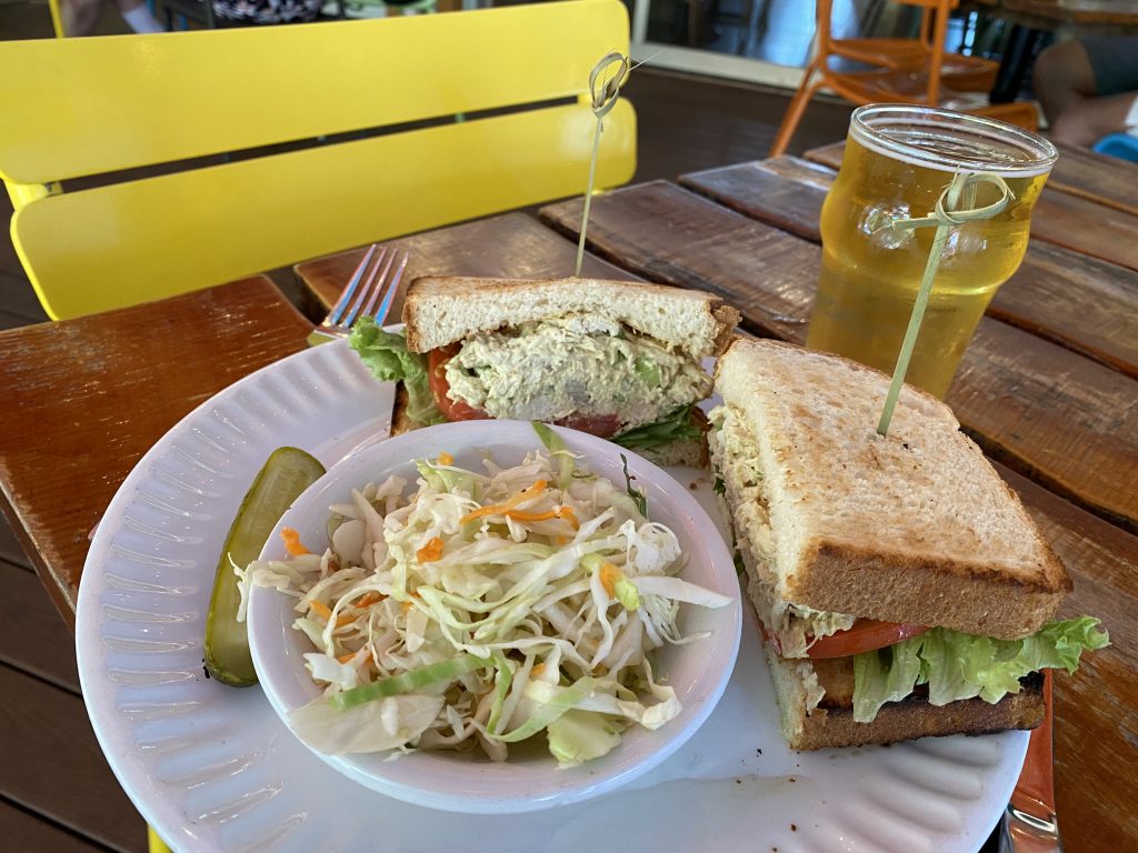 chicken salad sandwich, coleslaw, pickle and a beer